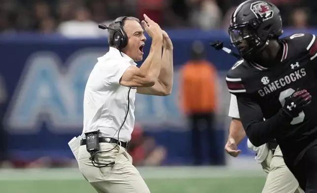 South Carolina head coach Shane Beamer yells to his players during an NCAA college football game against Virginia Tech, Sunday, Aug. 31, 2025, in Atlanta. (AP Photo/Brynn Anderson)