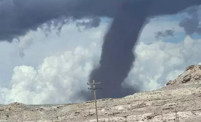 In this photo released by the Navajo Police Department, a tornado funnel is seen Sat., Sept. 13, 2025, northeast of Montezuma Creek, Utah. (Navajo Police Department via AP)