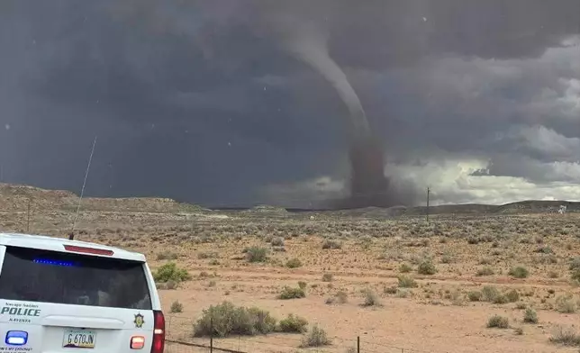 In this photo released by the Navajo Police Department, a tornado funnel is seen Sat., Sept. 13, 2025, northeast of Montezuma Creek, Utah. (Navajo Police Department via AP)