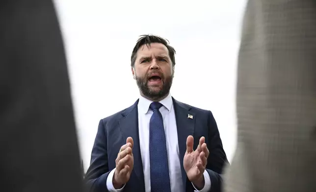 Vice President JD Vance speaks to reporters at Minneapolis-Saint Paul International Airport after paying his respects to victims of the Annunciation Catholic Church shooting in Minneapolis, Wednesday, Sept. 3, 2025. (Alex Wroblewski/Pool via AP)