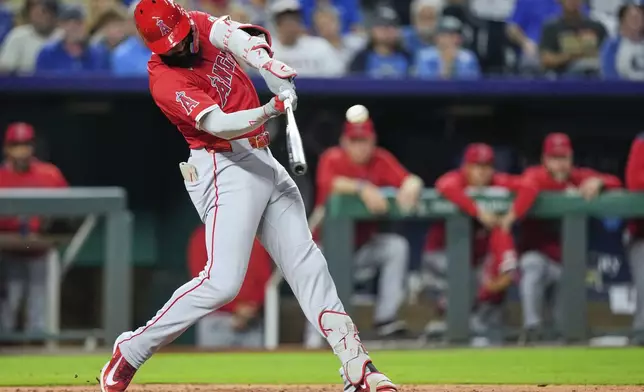 Los Angeles Angels' Jo Adell hits a three-run home run during the sixth inning of a baseball game against the Kansas City Royals, Wednesday, Sept. 3, 2025, in Kansas City, Mo. (AP Photo/Charlie Riedel)