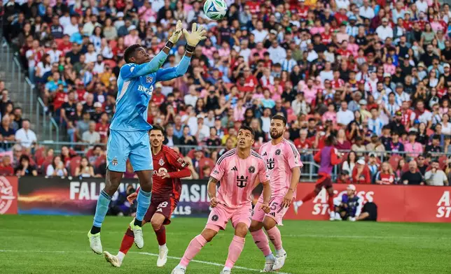 Toronto FC goalkeeper Sean Johnson (1) makes a catch as he defends against Inter Miami during the second half of a MLS soccer game, Saturday, Sept. 27, 2025, in Toronto. (Sammy Kogan/The Canadian Press via AP)