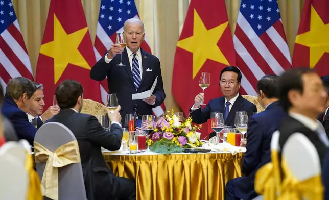 FILE - U.S. President Joe Biden raises a toast as he participates in a State Luncheon with Vietnam President Vo Van Thuong in Hanoi, Vietnam, on Sept. 11, 2023. (AP Photo/Evan Vucci, File)