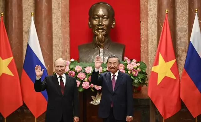 FILE - Russian President Vladimir Putin, left, and Vietnam's President To Lam pose for photos at the Presidential Palace in Hanoi, Vietnam on June 20, 2024. (Nhac Nguyen/Pool Photo via AP, File)
