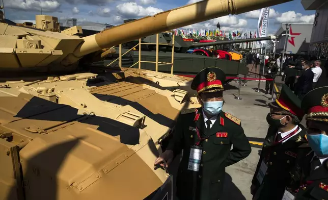 FILE - Military visitors from Vietnam observe the Russian T-90MS tank during the International Military Technical Forum Army-2020 in Alabino, outside Moscow, Russia, on Aug. 23, 2020. (AP Photo/Pavel Golovkin, File)