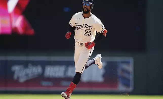 Minnesota Twins' Byron Buxton (25) runs the bases after hitting a two-run home run during the third inning of a baseball game against the San Diego Padres, Sunday, Aug. 31, 2025, in Minneapolis. (AP Photo/Abbie Parr)