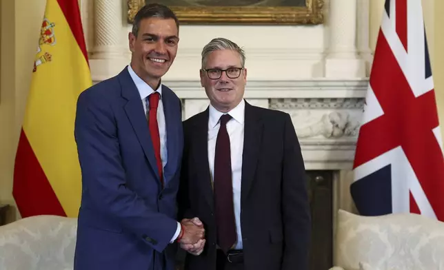 British Prime Minister Keir Starmer, right, and Spanish Prime Minister Pedro Sanchez shake hands during a meeting inside 10 Downing Street, in London, Wednesday, Sept. 3, 2025. (Toby Melville, Pool Photo via AP)