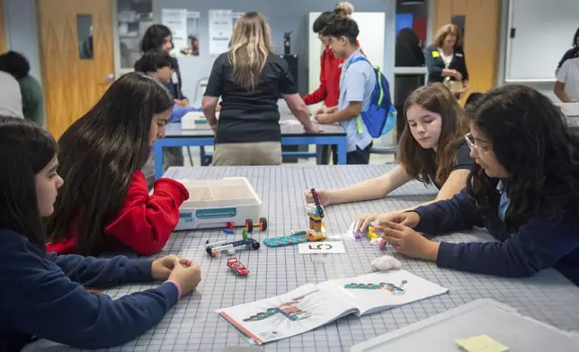 Students work on a project during a LEGO Education science lesson at Lorenzo De Zavala Middle School on Thursday, Aug. 21, 2025, in Irving, Texas. (AP Photo/Ronaldo Bolaños)