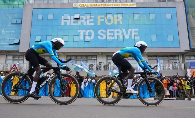 Team Rwanda competes, during the team time trial mixed relay event, at the road cycling World Championships in Kigali, Rwanda, Wednesday, Sept. 24, 2025. (AP Photo/Jerome Delay)