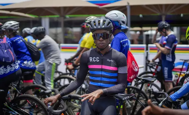 Amateur cyclists take part in a social ride on the eve of the start of the UCI road cycling world championships In Kigali, Rwanda, Saturday, Sept. 20, 2025. (AP Photo/Jerome Delay)