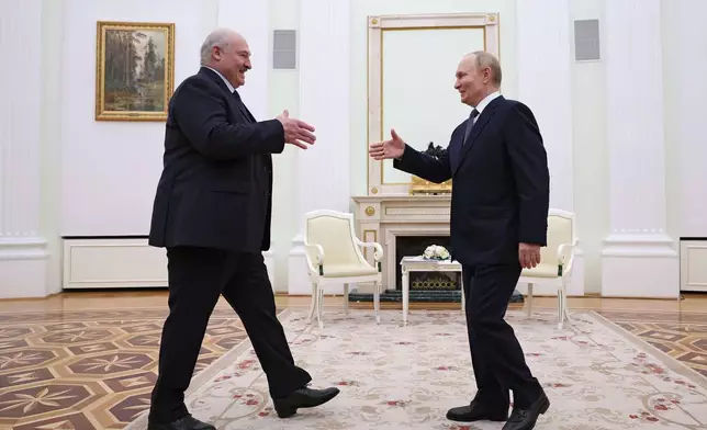 Russian President Vladimir Putin, right, and Belarusian President Alexander Lukashenko shake hands during their meeting a the Kremlin in Moscow, Russia, Friday, Sept. 26, 2025. (Ramil Sitdikov/Pool Photo via AP)