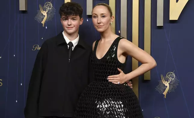Owen Cooper, left, and Erin Doherty arrive at the 77th Primetime Emmy Awards on Sunday, Sept. 14, 2025, at the Peacock Theater in Los Angeles. (Photo by Richard Shotwell/Invision/AP)