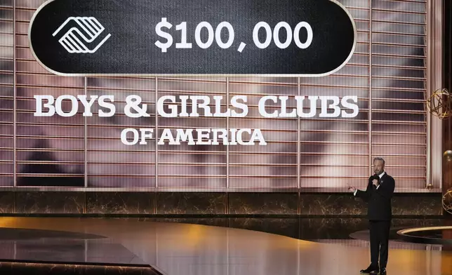 Host Nate Bargatze pleges a donation during the 77th Primetime Emmy Awards on Sunday, Sept. 14, 2025, at the Peacock Theater in Los Angeles. (AP Photo/Chris Pizzello)