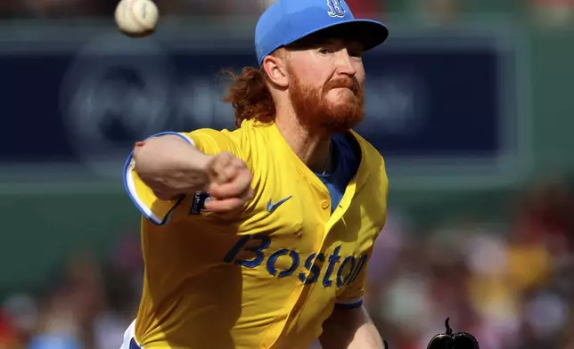 Boston Red Sox pitcher Dustin May throws during the first inning of a baseball game against the Pittsburgh Pirates, Saturday, Aug. 30, 2025, in Boston. (AP Photo/Mark Stockwell)