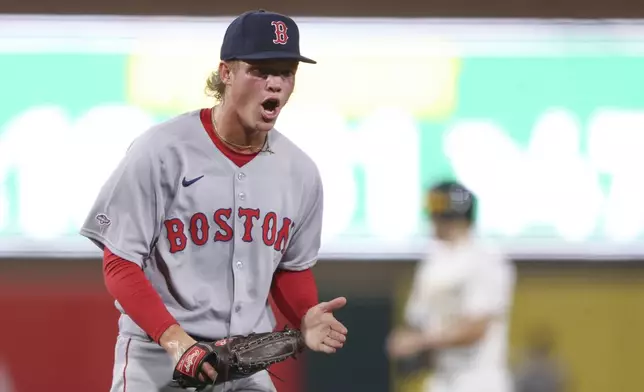 Boston Red Sox starting pitcher Connelly Early reacts after the final out of the third inning of a baseball game as he makes his MLB Debut against the Athletics, Tuesday, Sept. 9, 2025, in West Sacramento, Calif. (AP Photo/Scott Marshall)