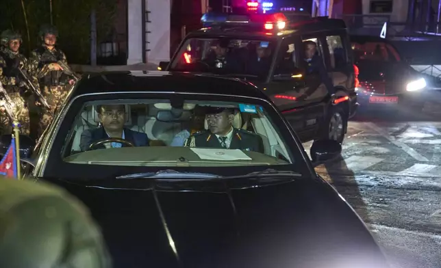 Former Supreme Court Chief Justice Sushila Karki leaves the president's residence after she was appointed as interim prime minister following protests that collapsed the previous administration in Kathmandu, Nepal, Friday, Sept. 12, 2025. (AP Photo/Niranjan Shrestha)