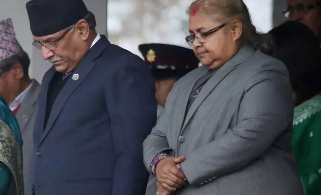 FILE - Chief Justice of the Supreme Court Sushila Karki, right, observes a minute's silence during Democracy Day in Kathmandu, Nepal, Friday, Feb. 18, 2017. (AP Photo/Niranjan Shrestha, File)