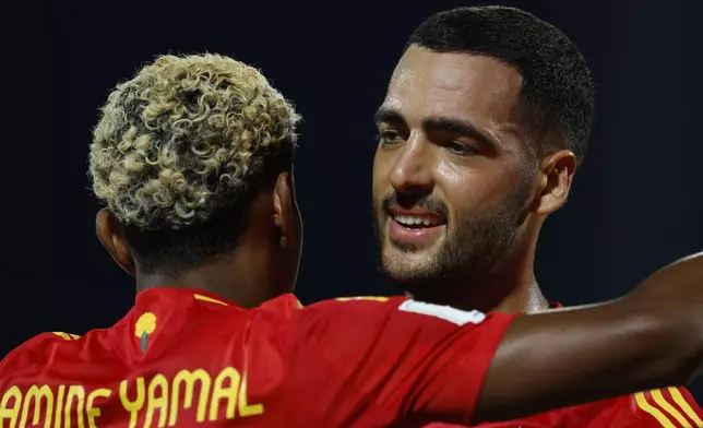 Spain's Mikel Merino, right, celebrates after scoring his side's third goal with Lamine Yamal during the World Cup Group E qualifying soccer match between Bulgaria and Spain in Sofia, Bulgaria, Thursday, Sept. 4, 2025. (AP Photo/ Tony Uzunov)