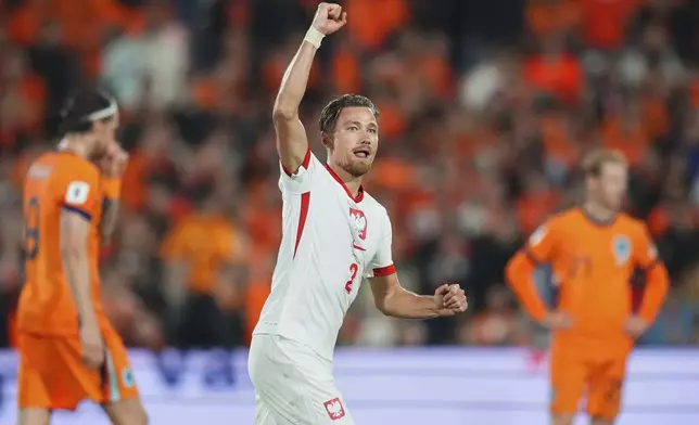 Poland's Matty Cash celebrates after scoring during a World Cup qualifying soccer match between the Netherlands and Poland in Rotterdam, Netherlands, Thursday, Sept. 4, 2025. (AP Photo/Peter Dejong)