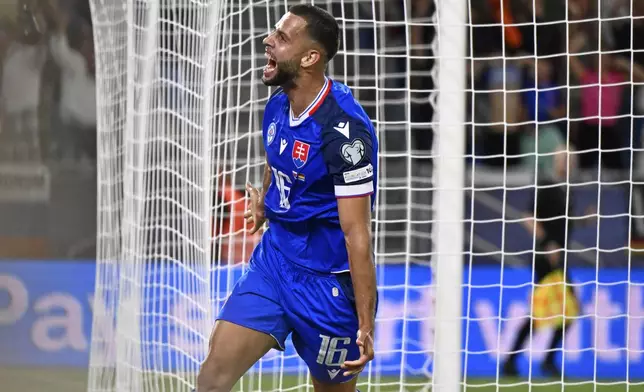 Slovakia's David Hancko celebrates after scoring the opening goal during the World Cup Group A qualifying soccer match between Slovakia and Germany in Bratislava, Slovakia, Thursday, Sept. 4, 2025. (AP Photo/Denes Erdos)
