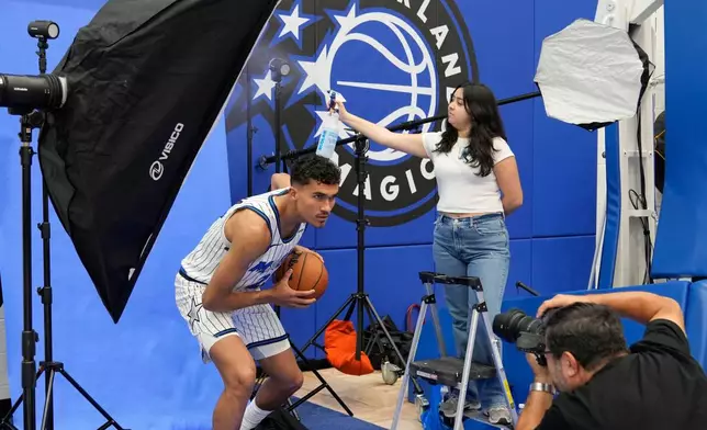 Orlando Magic forward Tristan da Silva, left, poses for a photo during the NBA basketball team's media day, Monday, Sept. 29, 2025, in Orlando, Fla. (AP Photo/John Raoux)