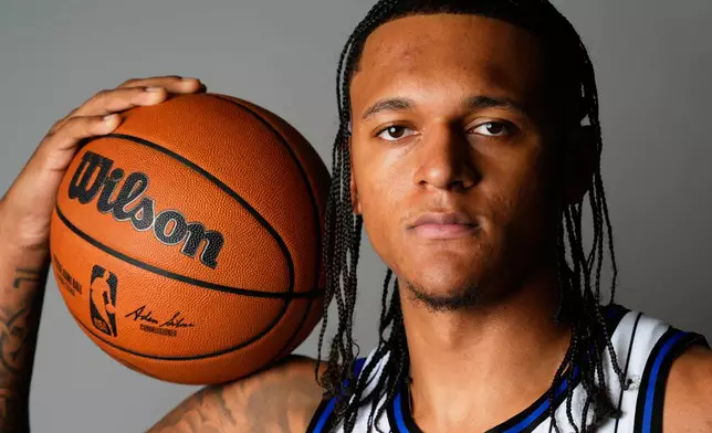Orlando Magic forward Paolo Banchero poses for a photo during the NBA basketball team's Media Day, Monday, Sept. 29, 2025, in Orlando, Fla. (AP Photo/John Raoux)