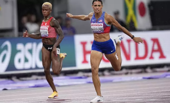 United States' Sydney McLaughlin-Levrone reacts after winning gold medal in the women's 400 meters final at the World Athletics Championships in Tokyo, Thursday, Sept. 18, 2025. (AP Photo/Eugene Hoshiko)
