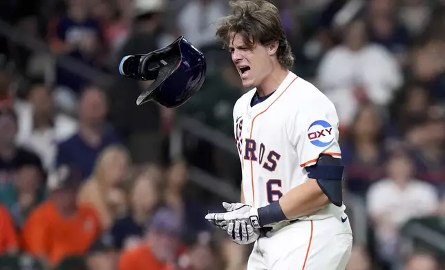 Houston Astros' Jake Meyers reacts after being hit by a pitch during the ninth inning of a baseball game against the Seattle Mariners, Saturday, Sept. 20, 2025, in Houston. (AP Photo/Eric Christian Smith)