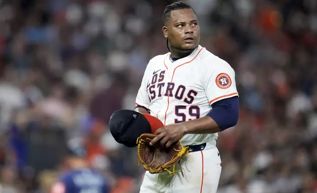 Houston Astros starting pitcher Framber Valdez (59) walks to the dugout after being pulled from the game during the fifth inning against the Seattle Mariners, Saturday, Sept. 20, 2025, in Houston. (AP Photo/Eric Christian Smith)