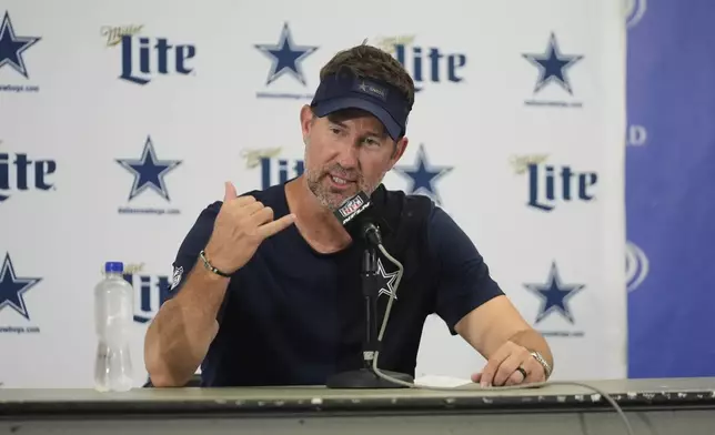 Dallas Cowboys head coach Brian Schottenheimer responds to questions during a news conference after the team's NFL football game against the Chicago Bears Sunday, Sept. 21, 2025, in Chicago. (AP Photo/Erin Hooley)