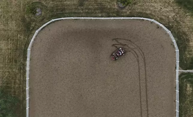 MK Bashar drives an electric tractor Tuesday, Aug. 19, 2025, during a demonstration in East Lansing, Mich. (AP Photo/Joshua A. Bickel)