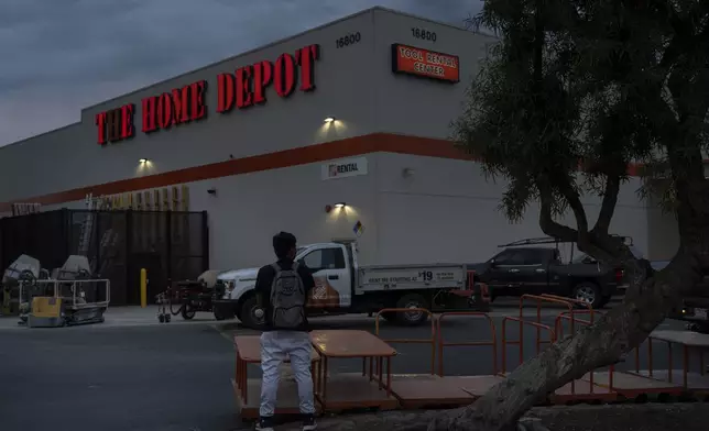 A day laborer waits for work in the parking lot of a Home Depot in the Van Nuys section of Los Angeles, TAug. 28, 2025. (AP Photo/Jae C. Hong)