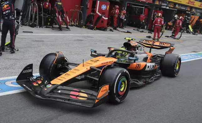 McLaren driver Lando Norris of Britain steers his car after a pit service during the Formula One Dutch Grand Prix race at the Zandvoort racetrack in Zandvoort, Netherlands, Sunday, Aug. 31, 2025. (AP Photo/Patrick Post, Pool)