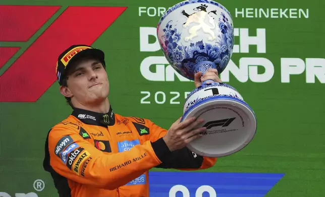 McLaren driver Oscar Piastri of Australia celebrtaes after winningthe Formula One Dutch Grand Prix in Zandvoort, Netherlands, Sunday, Aug. 31, 2025. (AP Photo/Peter Dejong)