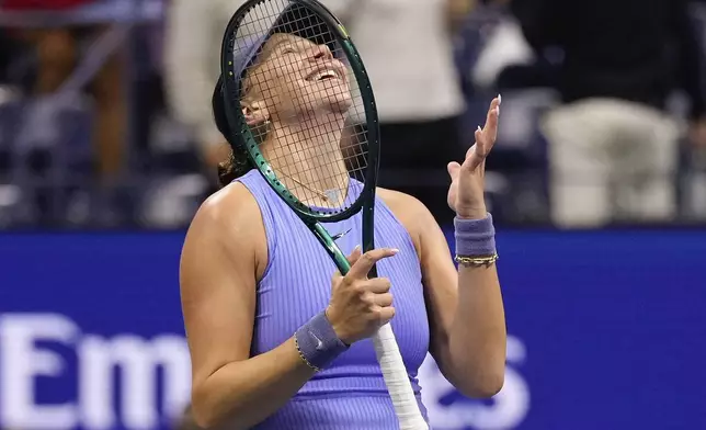 Amanda Anisimova, of the United States, reacts after defeating Naomi Osaka, of Japan, during the women's singles semifinals of the U.S. Open tennis championships, Friday, Sept. 5, 2025, in New York. (AP Photo/Seth Wenig)