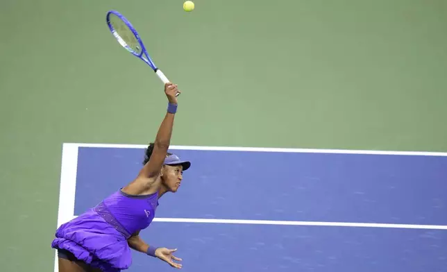 Naomi Osaka, of Japan, serves to Amanda Anisimova, of the United States, during the women's singles semifinals of the U.S. Open tennis championships, Thursday, Sept. 4, 2025, in New York. (AP Photo/Frank Franklin II)