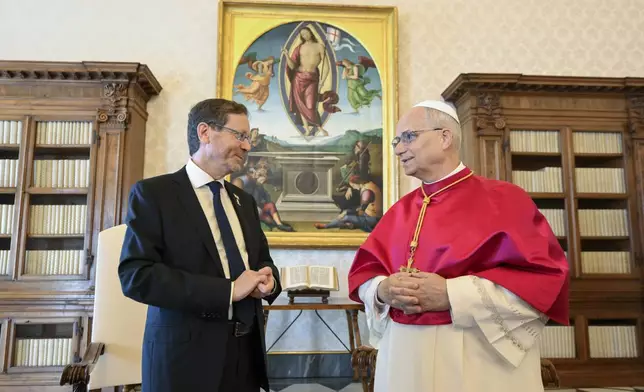 Israel's President Isaac Herzog, left, meets with Pope Leo XIV in the pope's private library during a private audience at the Vatican, Thursday, Sep. 4, 2025. (Simone Risoluti/Vatican Media via AP)