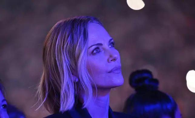 Actress Charlize Theron stands at ringside before an undisputed super middleweight championship boxing match between Canelo Alvarez and Terence Crawford in Las Vegas, Saturday, Sept. 13, 2025. (AP Photo/David Becker)
