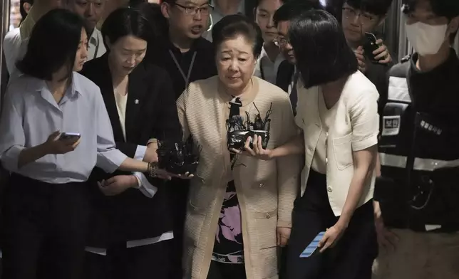 Hak Ja Han, center, the leader of South Korea's Unification Church, arrives at a special prosecutor's office in Seoul, South Korea, Wednesday, Sept. 17, 2025. (AP Photo/Lee Jin-man)