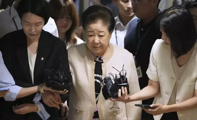 Hak Ja Han, center, the leader of South Korea's Unification Church, arrives at a special prosecutor's office in Seoul, South Korea, Wednesday, Sept. 17, 2025. (AP Photo/Lee Jin-man)