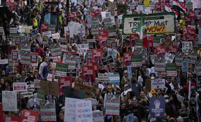 People march during Illinois Coalition for Immigrant &amp; Refugee Rights' "Chicago Says No Trump No Troops" protest Saturday, Sept. 6, 2025, in Chicago. (AP Photo/Carolyn Kaster)