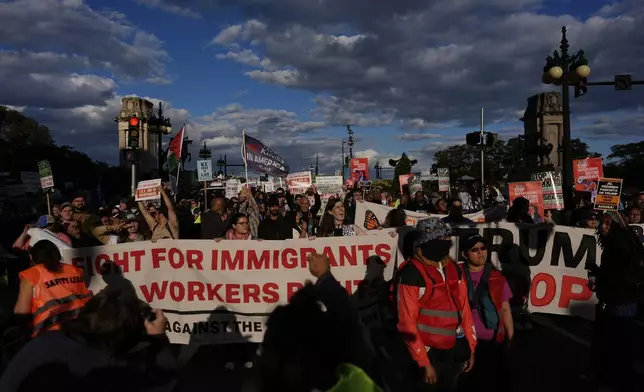 People march during Illinois Coalition for Immigrant &amp; Refugee Rights' "Chicago Says No Trump No Troops" protest Saturday, Sept. 6, 2025, in Chicago. (AP Photo/Carolyn Kaster)