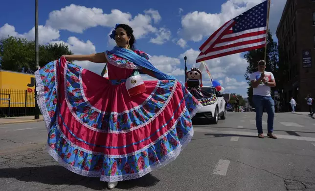 Participants perform during the 2025 Pilsen Mexican Independence Day parade Saturday, Sept. 6, 2025, in Chicago. (AP Photo/Carolyn Kaster)