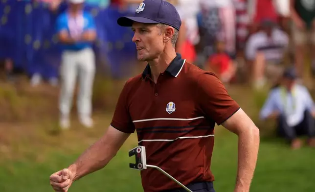 Europe's Justin Rose celebrates after a putt on the eighth hole at Bethpage Black golf course during the Ryder Cup golf tournament, Saturday, Sept. 27, 2025, in Farmingdale, N.Y. (AP Photo/Lindsey Wasson)