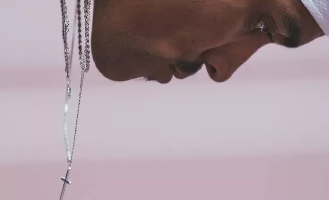 Germany's Joshua Abuaku prepares to compete in the men's 400 meters hurdles at the World Athletics Championships in Tokyo, Monday, Sept. 15, 2025. (AP Photo/Eugene Hoshiko)