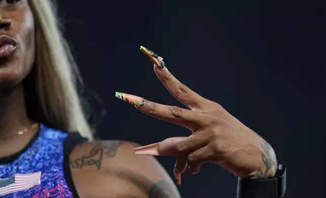 United States' Sha'Carri Richardson gestures after a women's 4 X 100 meters relay heat at the World Athletics Championships in Tokyo, Saturday, Sept. 20, 2025. (AP Photo/Petr David Josek)