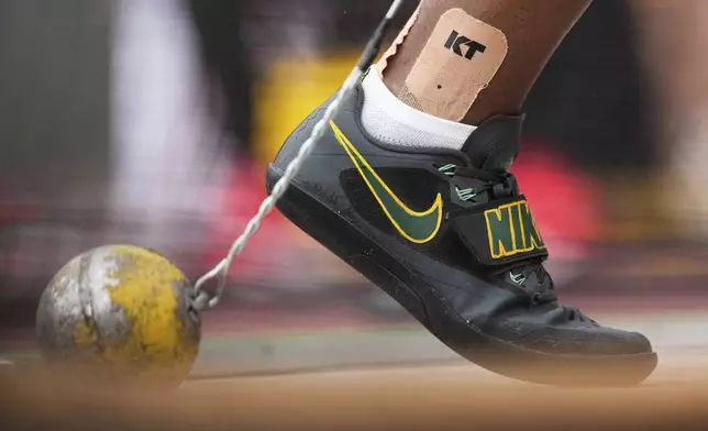 Jamaica's Nayoka Clunis competes in the women's hammer throw qualification at the World Athletics Championships in Tokyo, Sunday, Sept. 14, 2025. (AP Photo/Ashley Landis)