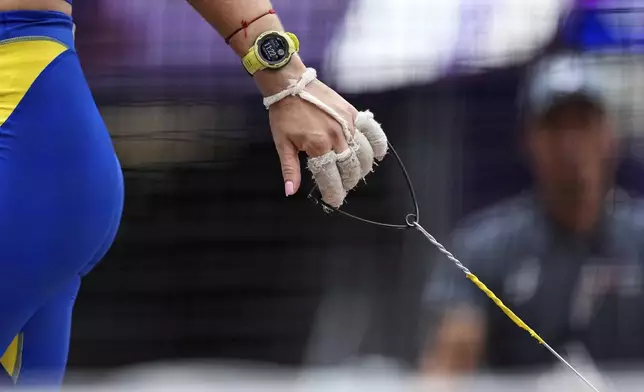 Ukraine's Iryna Klymets prepares for an attempt in the women's hammer throw qualification at the World Athletics Championships in Tokyo, Sunday, Sept. 14, 2025. (AP Photo/Matthias Schrader)