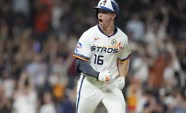 Houston Astros' Zachary Cole reacts after hitting a two-run home run off Texas Rangers starting pitcher Jack Leiter during the fifth inning of a baseball game Monday, Sept. 15, 2025, in Houston. (AP Photo/Karen Warren)