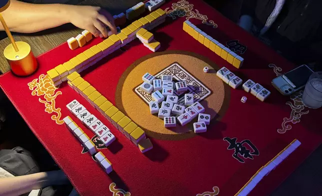 People play mahjong at an event organized by the YLL Mahjong Club on Friday, Aug. 15, 2025, in San Francisco. (AP Photo/Terry Chea)